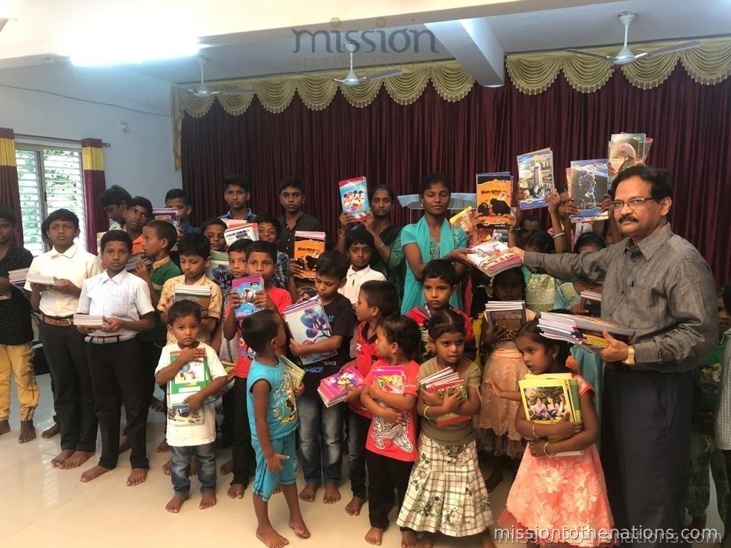 Book distribution day — every child receives supplies