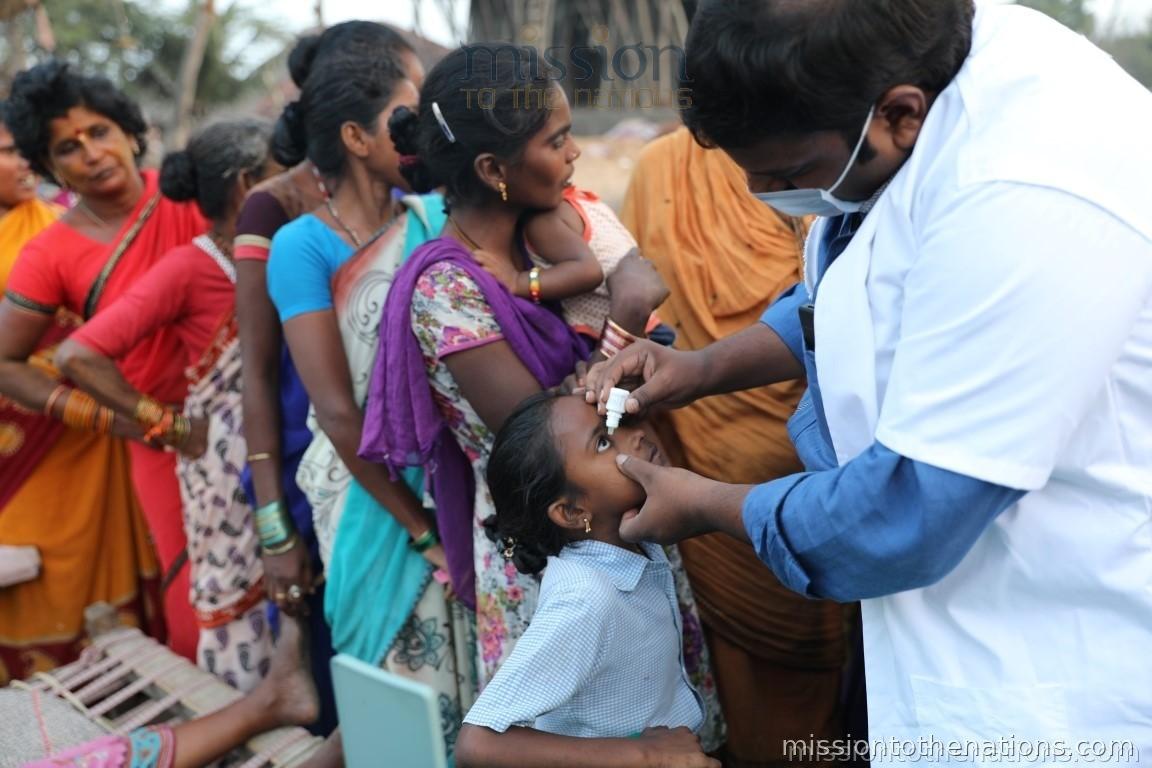 Eye treatment at a mobile camp