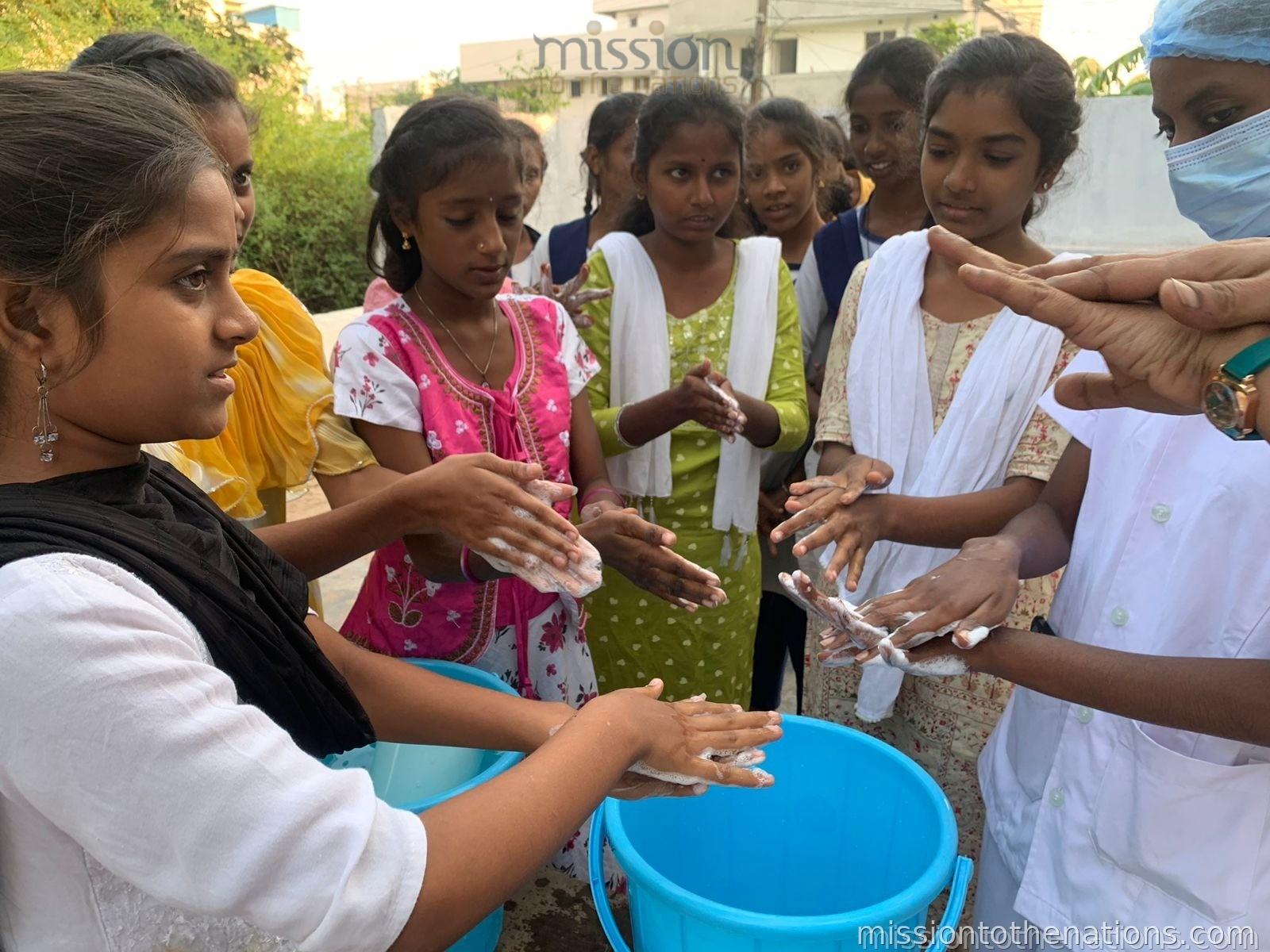 Students learning correct handwashing technique