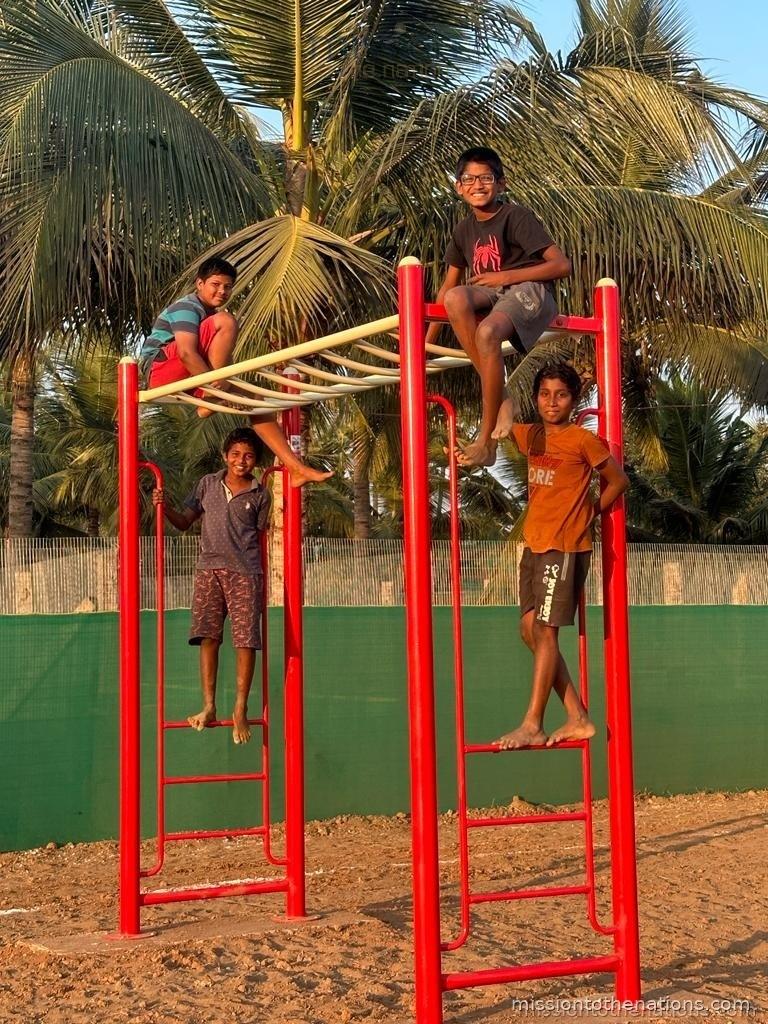 Boys on the climbing frame — play is part of the programme