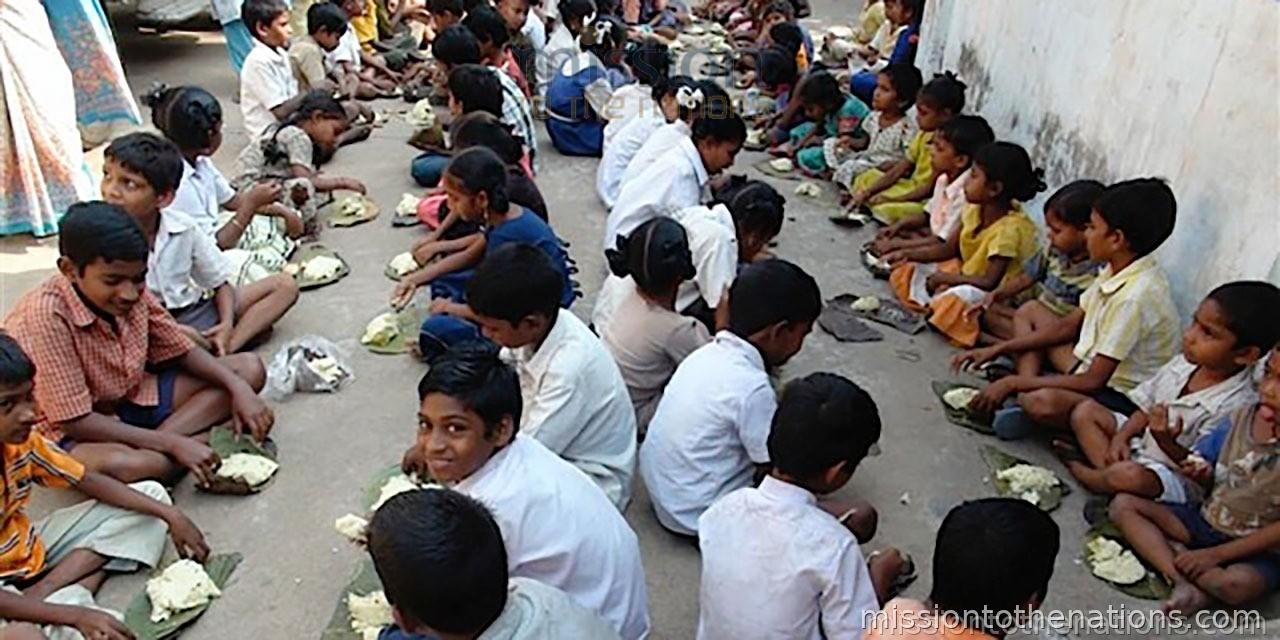 Street feeding — children eating together