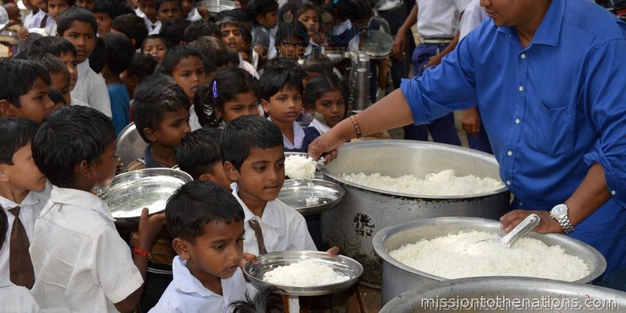 Meal distribution — school children lining up for lunch