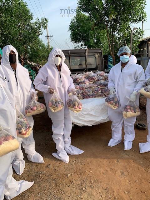 COVID squad distributing groceries