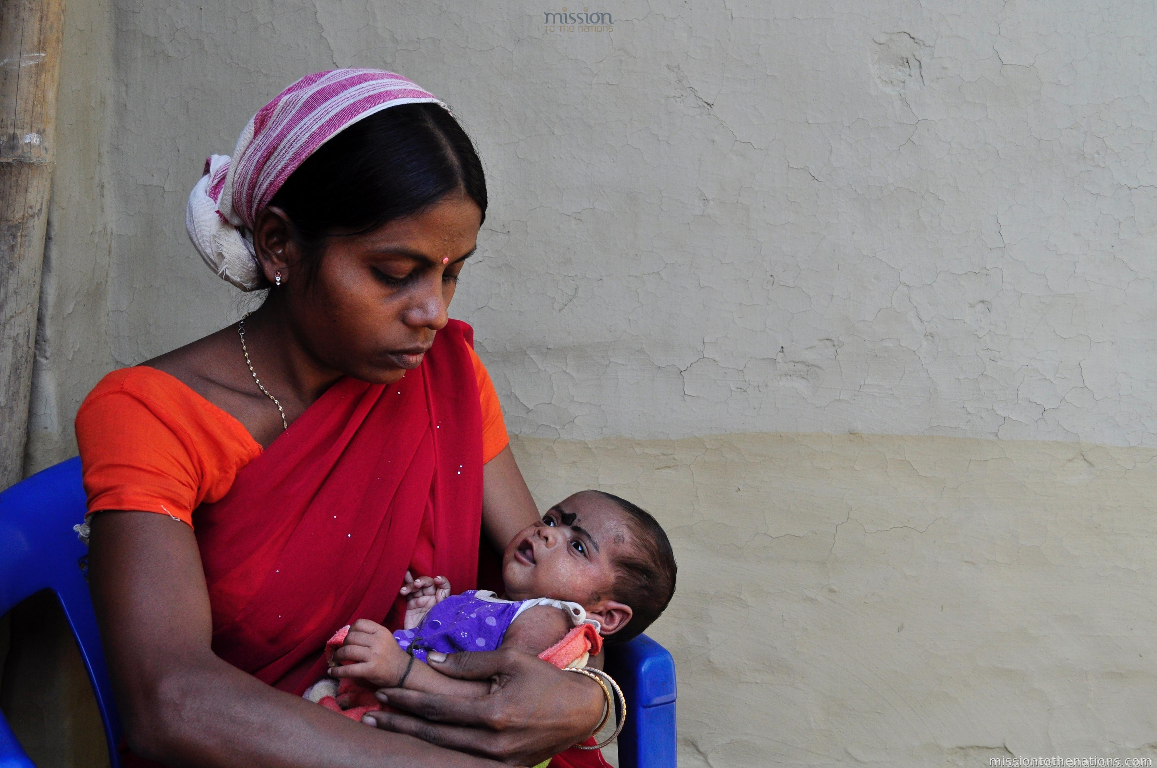 A mother holding her healthy infant — outcome of MTN's mother and child nutrition programme