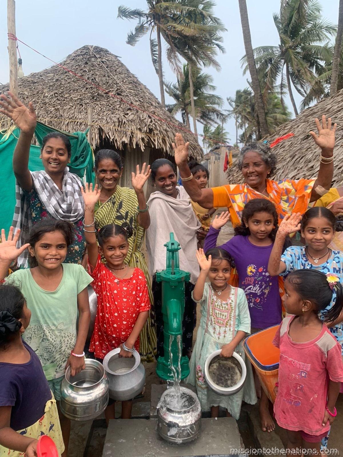 Children at a clean-water well