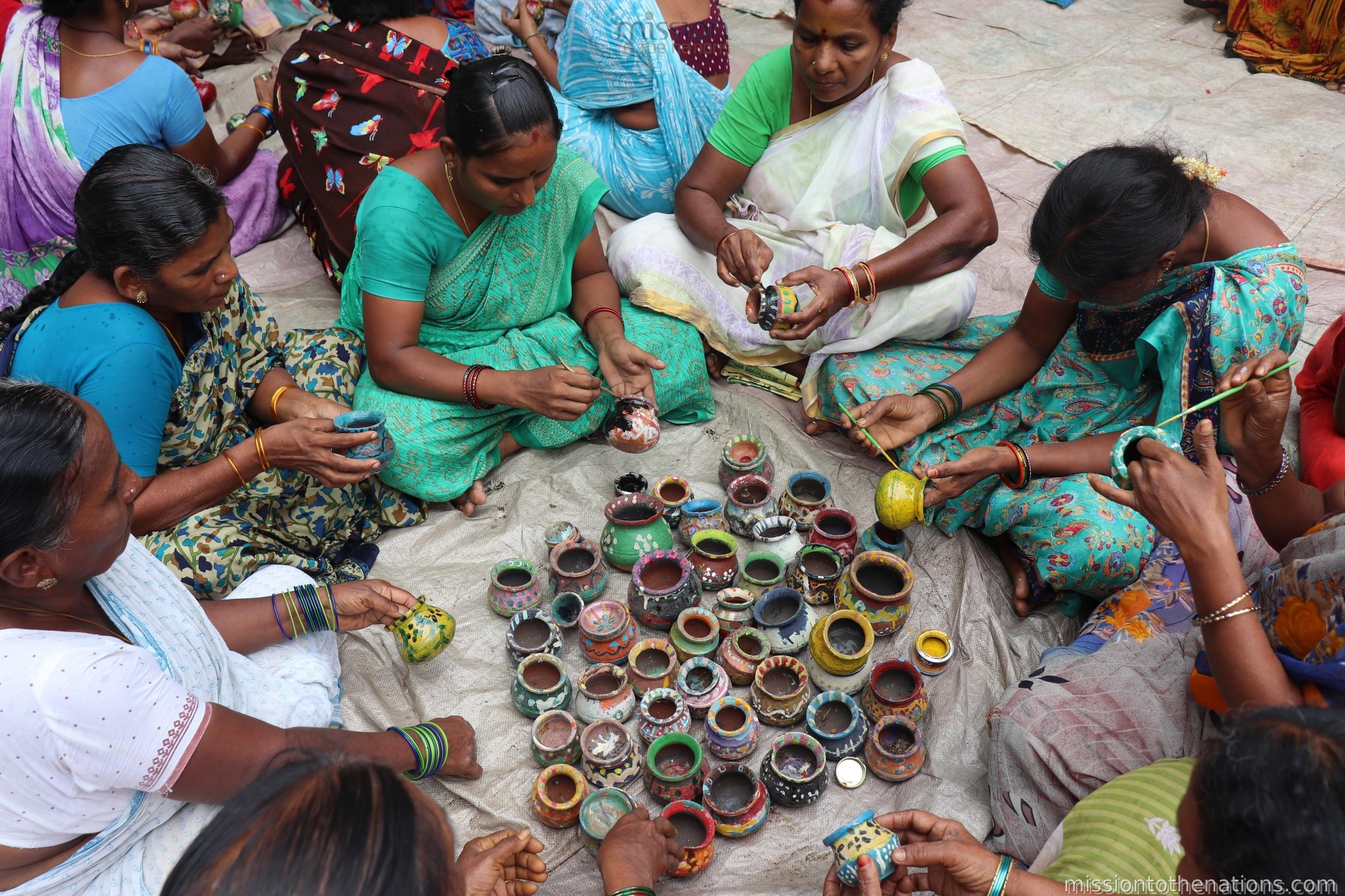 Women making decorative pots in MTN life skills class