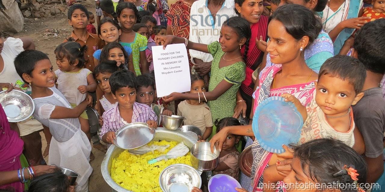 Children at a street feeding station